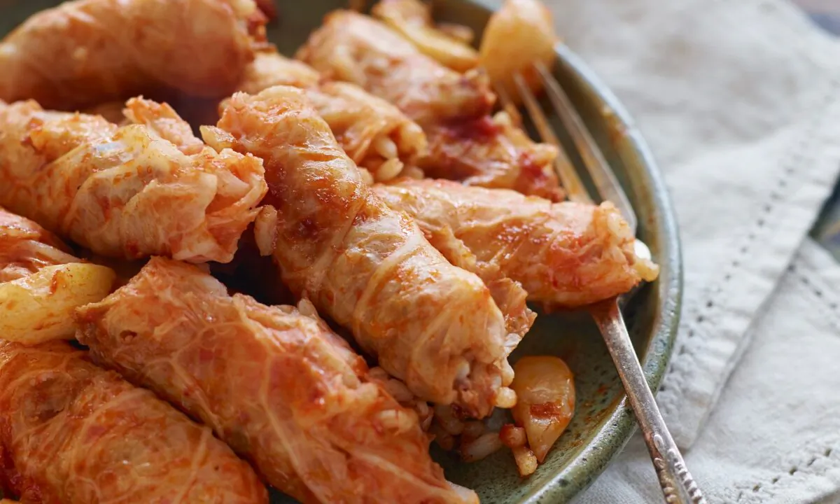 To make malfouf mahshi, cabbage leaves are stuffed with warm, spiced lamb and rice, then simmered in a tangy tomato broth until melt-in-your-mouth tender. (Courtesy of Julie Ann Sageer)