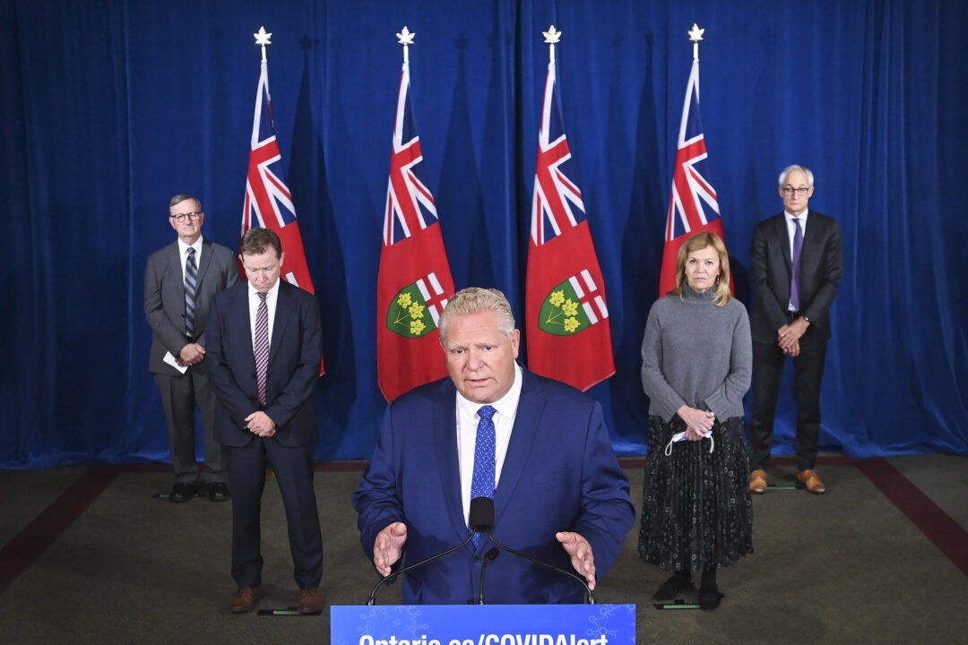 Ontario Premier Doug Ford holds a press conference with his medical team regarding new restrictions at Queen's Park during the COVID-19 pandemic in Toronto on  Oct. 2, 2020. (The Canadian Press/Nathan Denette)