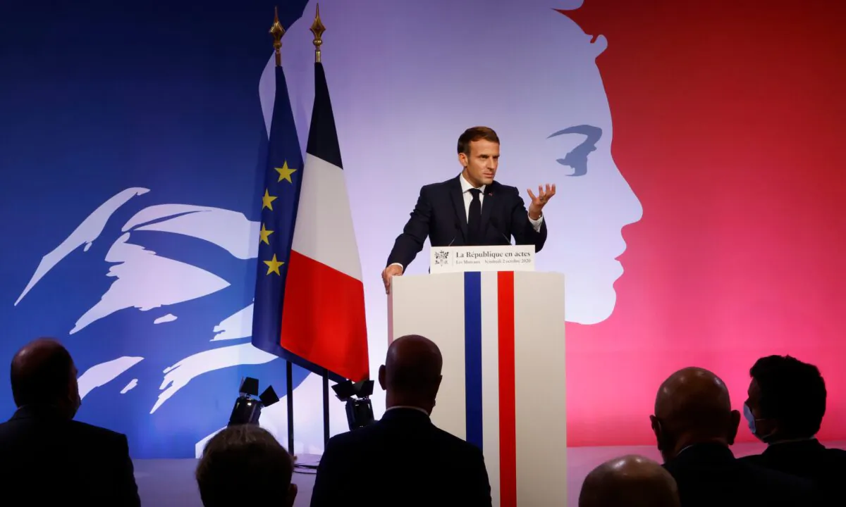 French President Emmanuel Macron delivers a speech to present his strategy to fight separatism, in Les Mureaux, outside Paris, on Oct. 2, 2020. (Ludovic Marin/Pool via AP)