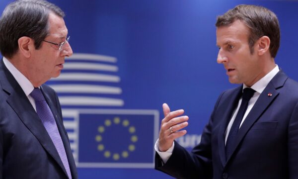 French President Emmanuel Macron speaks with Cypriot President Nicos Anastasiades