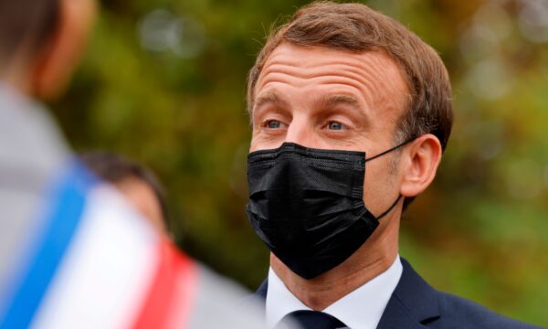 French President Emmanuel Macron wears a protective face mask