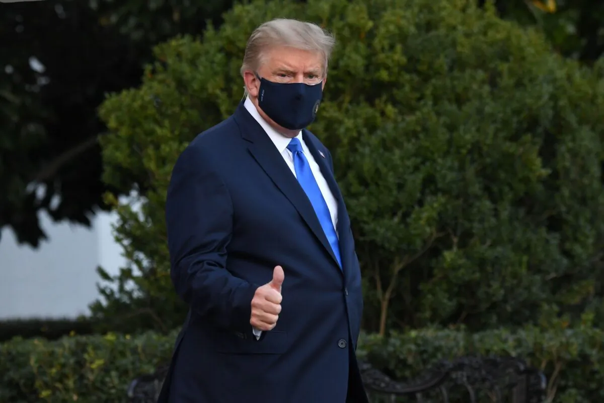 President Donald Trump walks to Marine One prior to departure from the South Lawn of the White House in Washington, as he heads to Walter Reed Military Medical Center on Oct. 2, 2020. (Saul Loeb/AFP via Getty Images)