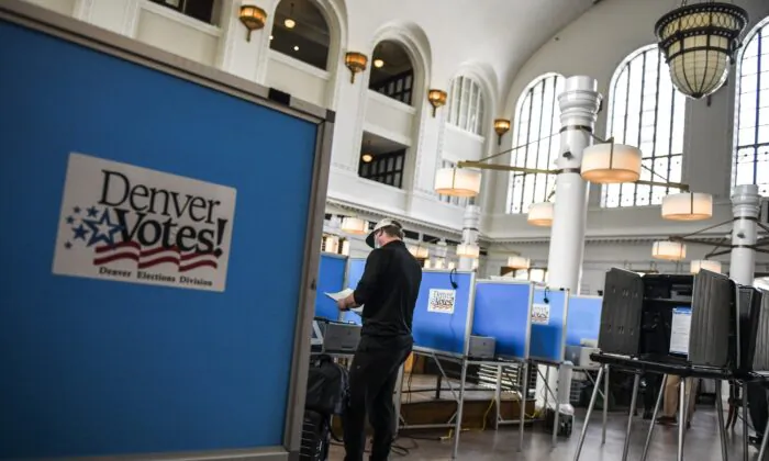 A man votes in Denver, Colo., on June 30, 2020. (Michael Ciaglo/Getty Images)