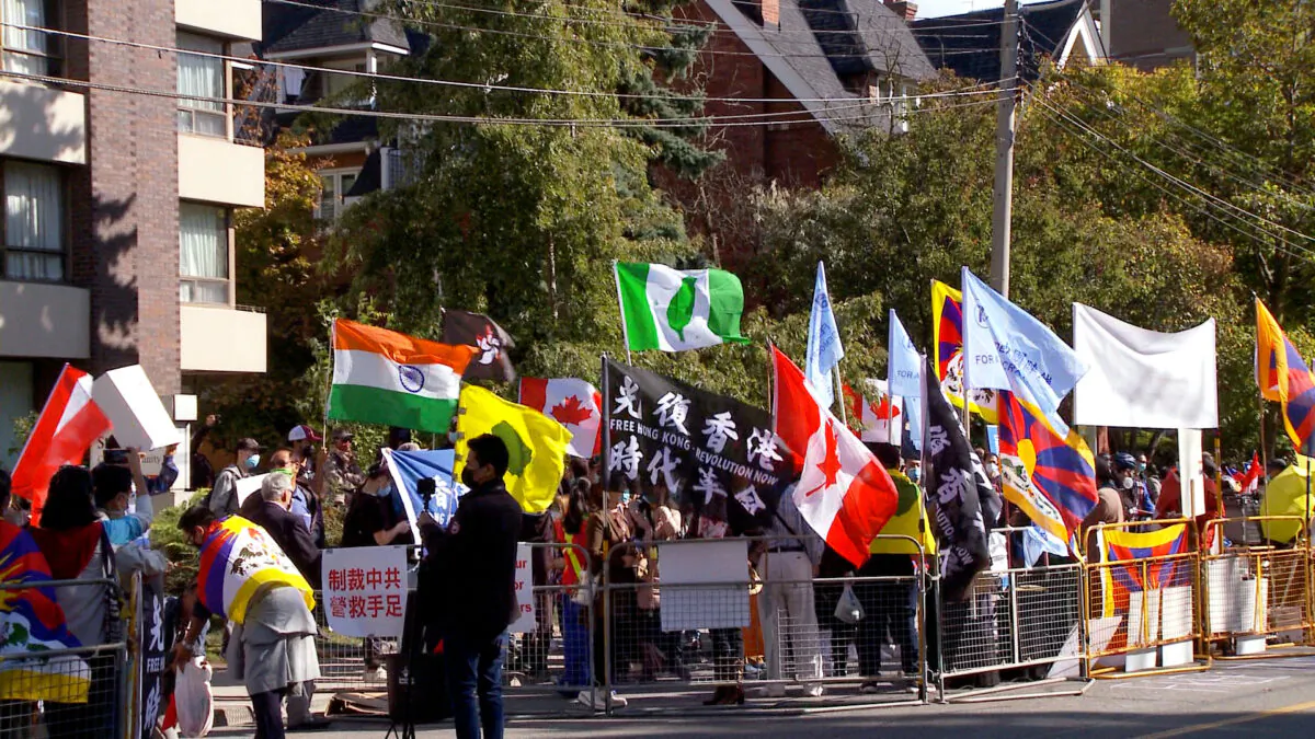 Tibetans, Uyghurs, Kazakhs, Hongkongers, Southern Mongolians, Taiwanese, and Chinese Democracy Activists join together for the Global Day of Action to call on governments to stand against the Chinese Communist Party’s suppression of freedom, democracy, and human rights, in front of the Chinese Consulate in Toronto on Oct. 1, 2020. (NTD Television)