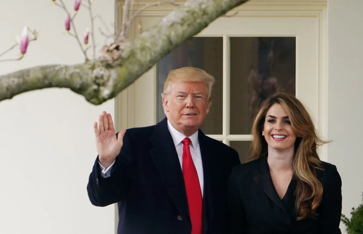 President Donald Trump poses with former communications director Hope Hicks shortly before making his way to board Marine One on the South Lawn and departing from the White House on March 29, 2018. (Mandel Ngan/AFP via Getty Images)