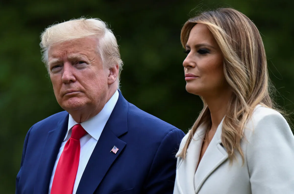 President Donald Trump and First Lady Melania Trump walk from the Marine One helicopter back to the White House after traveling to Fort McHenry in Baltimore for Memorial Day holiday commemorations from Washington on May 25, 2020. (Erin Scott/Reuters)