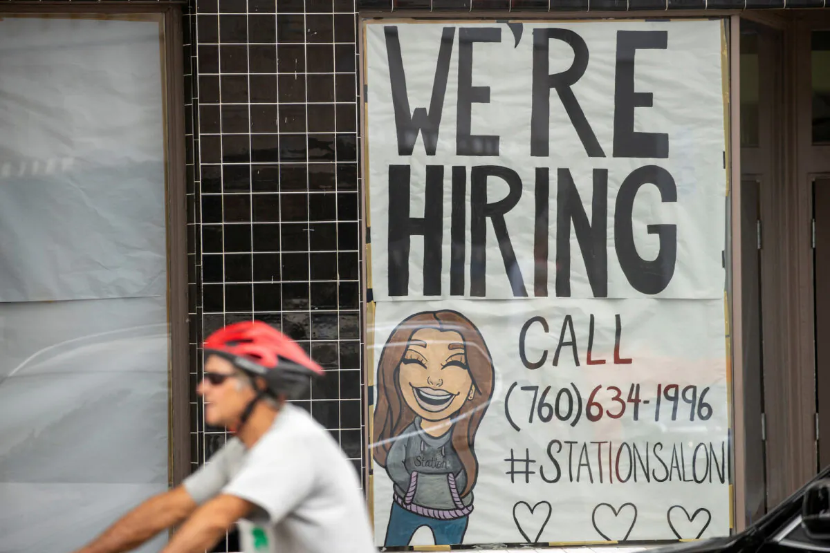 A new business advertises for workers as it prepares to open up in Encinitas, Calif., on July 30, 2020. (Mike Blake/Reuters)