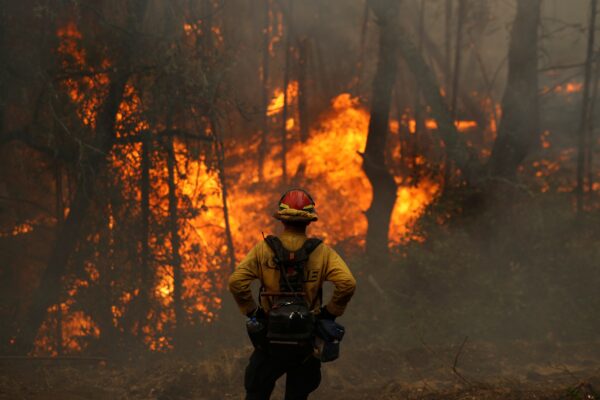 A firefighter monitors a firing operation