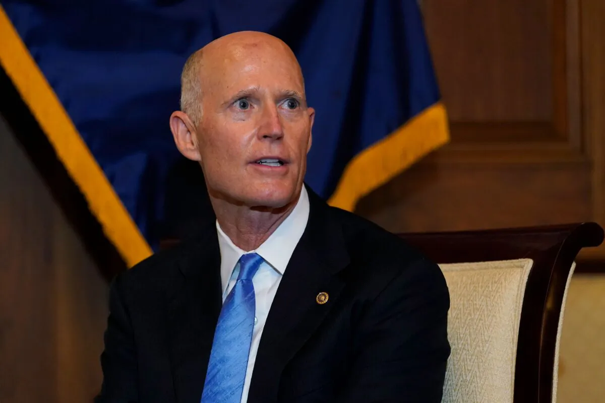 Sen. Rick Scott (R-Fla.) answers a reporter's question as he meets with Judge Amy Coney Barrett (out of frame), nominee for the Supreme Court, on Capitol Hill in Washington on Sept. 29, 2020. (Susan Walsh/Pool/AFP via Getty Images)