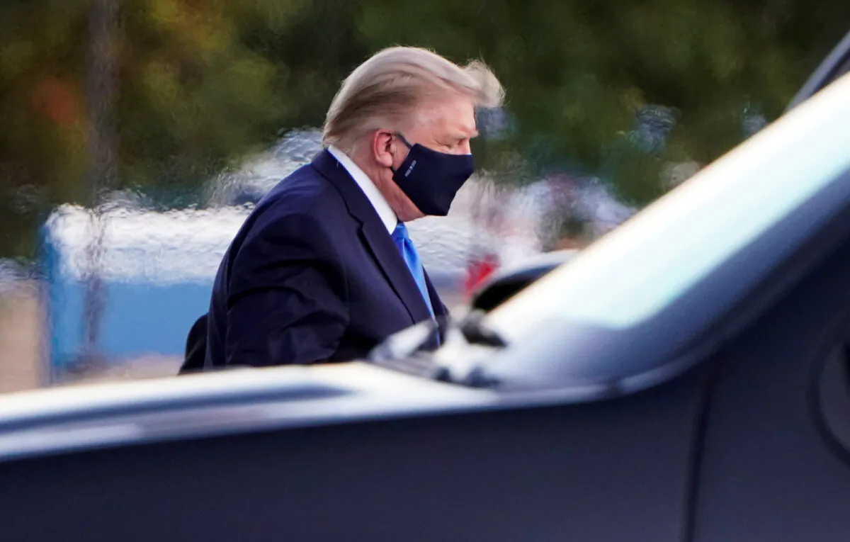 President Donald Trump arrives at Walter Reed National Military Medical Center by helicopter, in Bethesda, Md., on Oct. 2, 2020. (Joshua Roberts/Reuters)