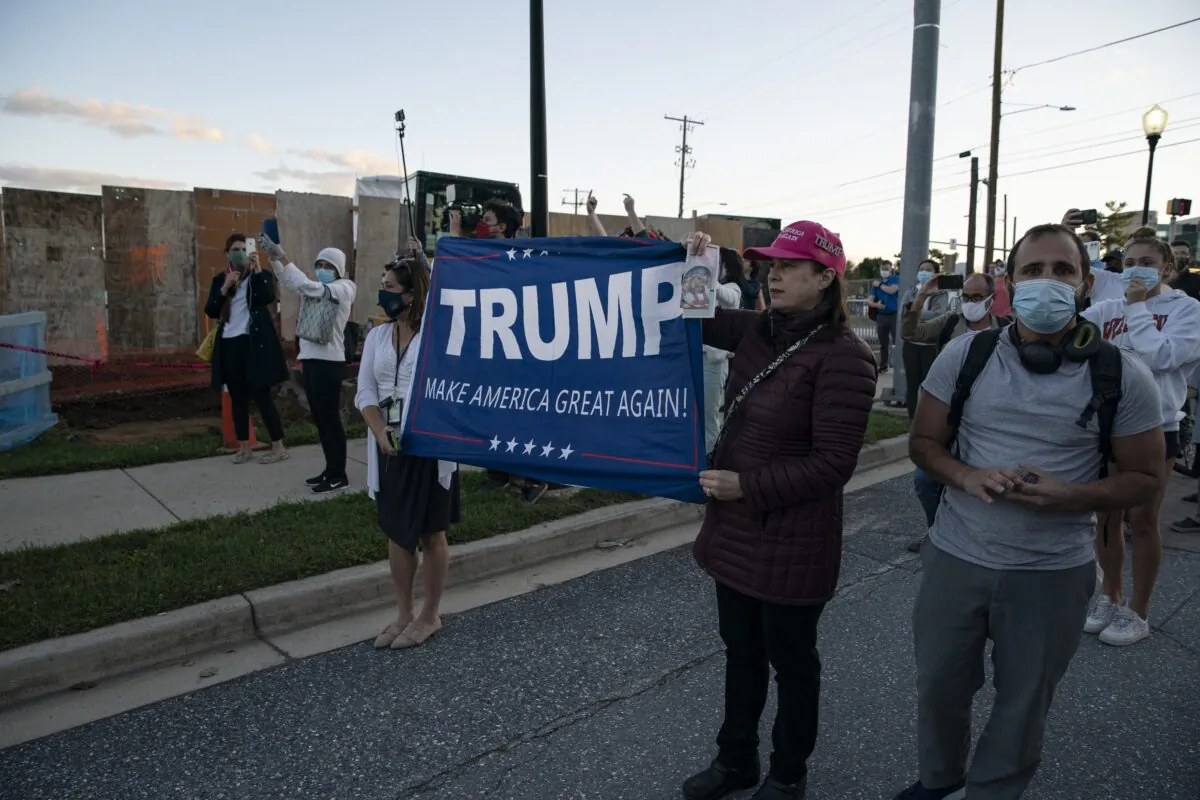 Supporters of President Donald Trump stand outside Walter Reed National Military Medical Center in Bethesda, Md., on Oct. 2, 2020. (Alex Edelman/Getty Images)