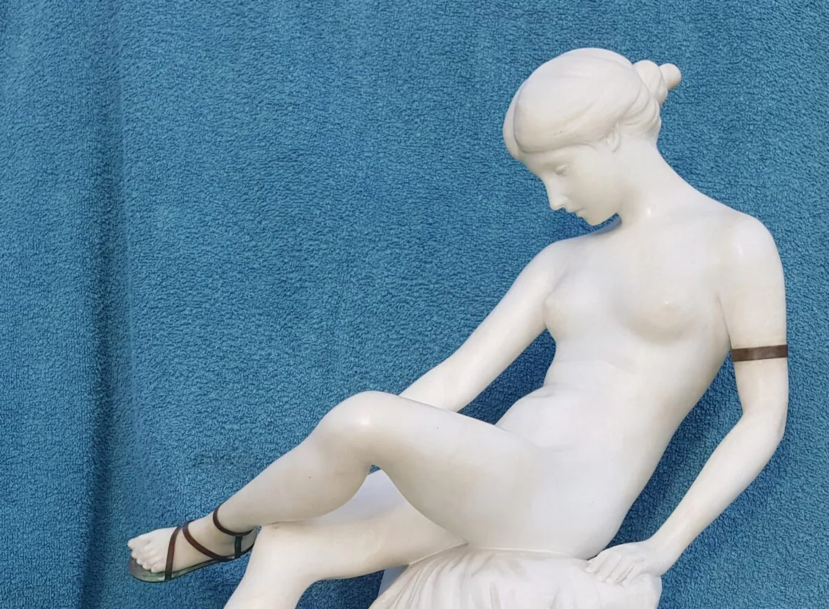 “Seated Maiden Lacing Her Sandal,”1920, Ernst Seger. Alabaster and bronze; 16.5 inches tall. (Courtesy of Wayne A. Barnes)