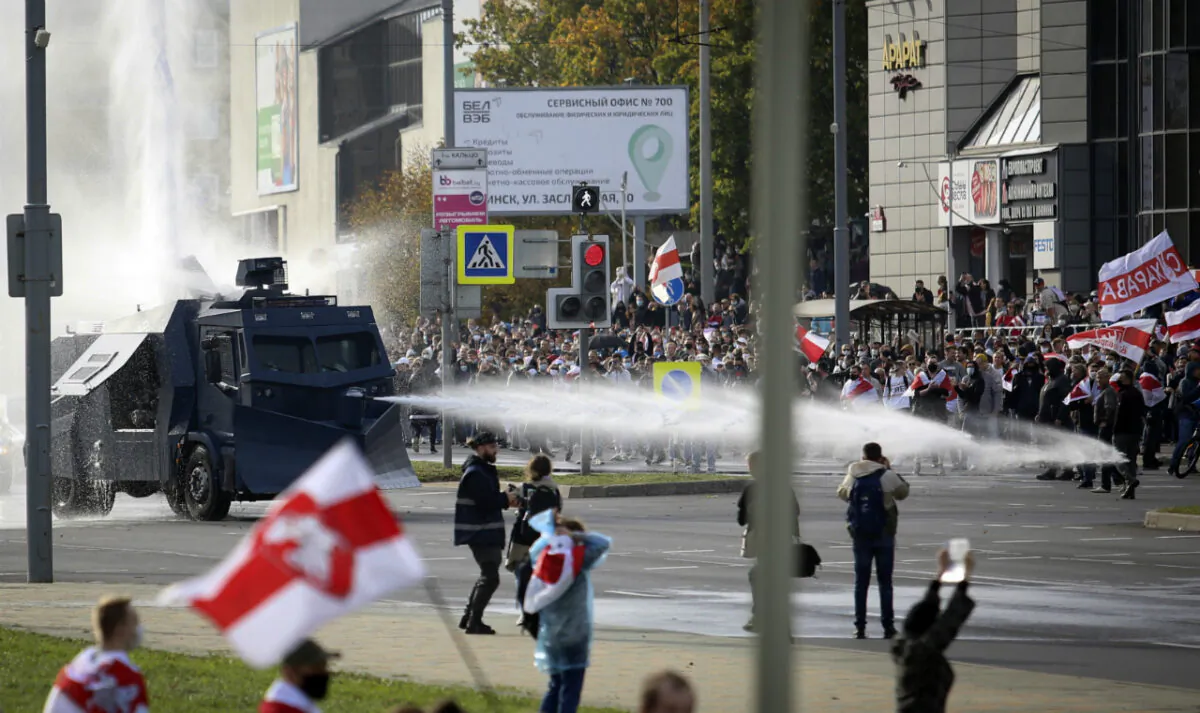 Police use a water cannon against demonstrators during a rally in Minsk, Belarus, on Oct. 4, 2020. (AP Photo)