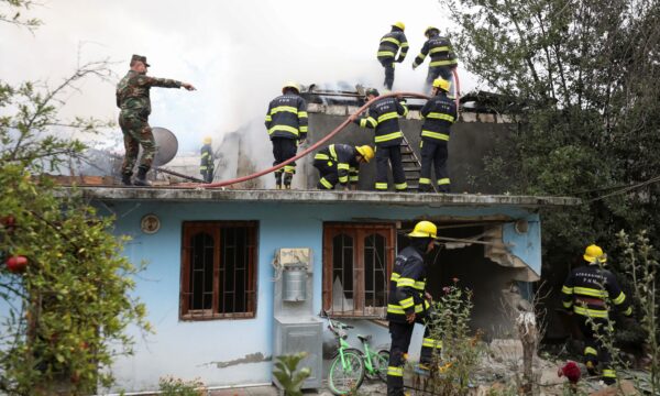 Firefighters battle a fire caused by shelling in the fighting 2