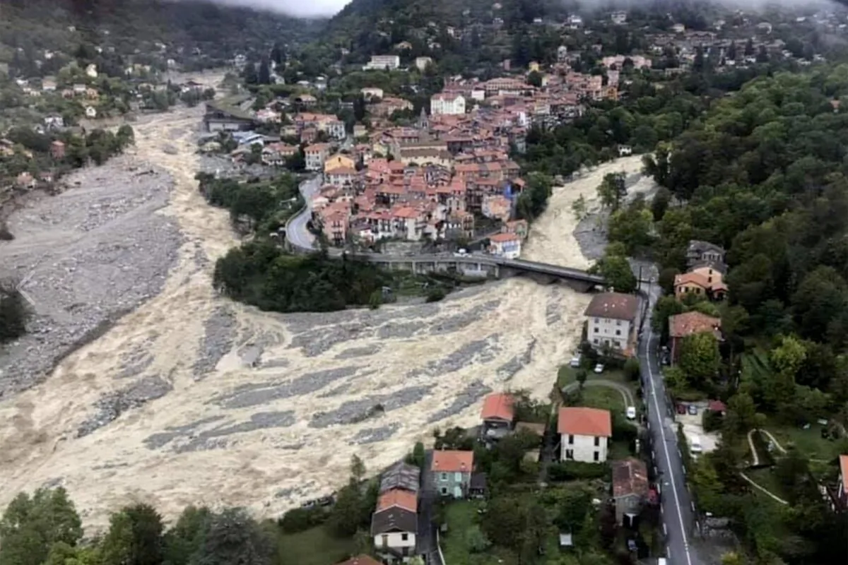 This aerial view provided on Oct.4, 2020 by the Alpes Maritimes region fire brigade show a house keeping a fragile balance on a hill while a rive floods on Oct.3. 2020 near La Vesubie, southern France. (SDIS 06 via AP)