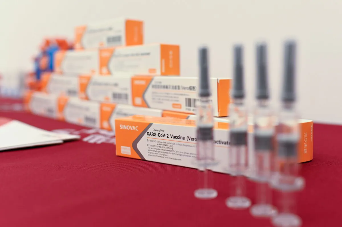 Sinovac Biotech vaccines are displayed at a press conference during a media tour of a new factory built to produce COVID-19 vaccines, in Beijing on Sept. 24, 2020. (Wang Zhao/AFP via Getty Images)