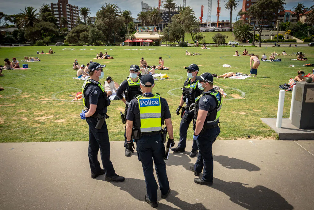 Victoria Police patrol at St Kilda beach in Melbourne, Australia on Oct. 3, 2020. (Darrian Traynor/Getty Images)