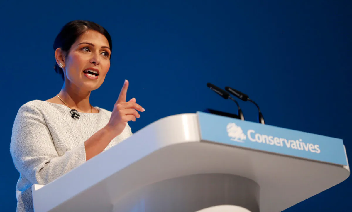 Britain's Home Secretary, Priti Patel, addresses the delegates at last year's Conservative Party Conference in Manchester, England, on Oct. 1, 2019. (AP Photo/Frank Augstein)