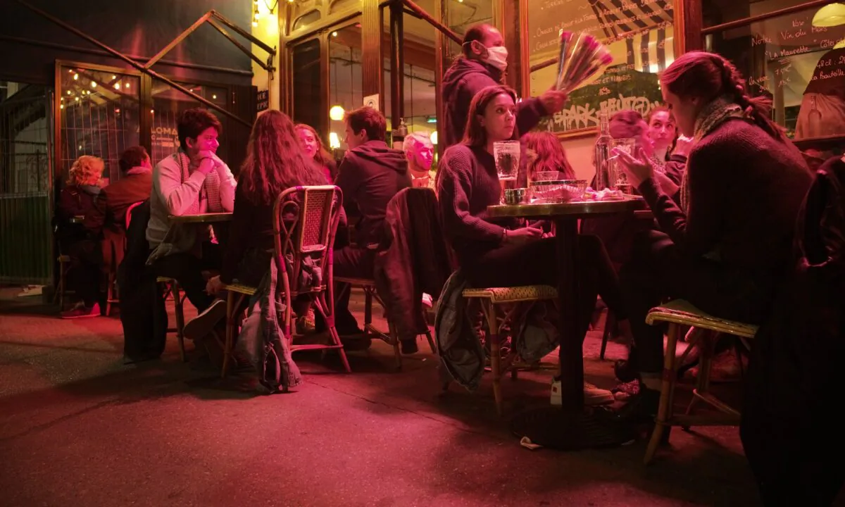 People enjoy a drink in a cafe terrace in Paris, on Sept.26, 2020. (Lewis Joly/AP Photo)