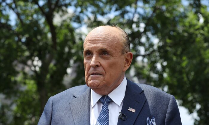 President Donald Trump's lawyer and former New York City Mayor Rudy Giuliani speaks to reporters outside the White House in Washington on July 1, 2020. (Chip Somodevilla/Getty Images)