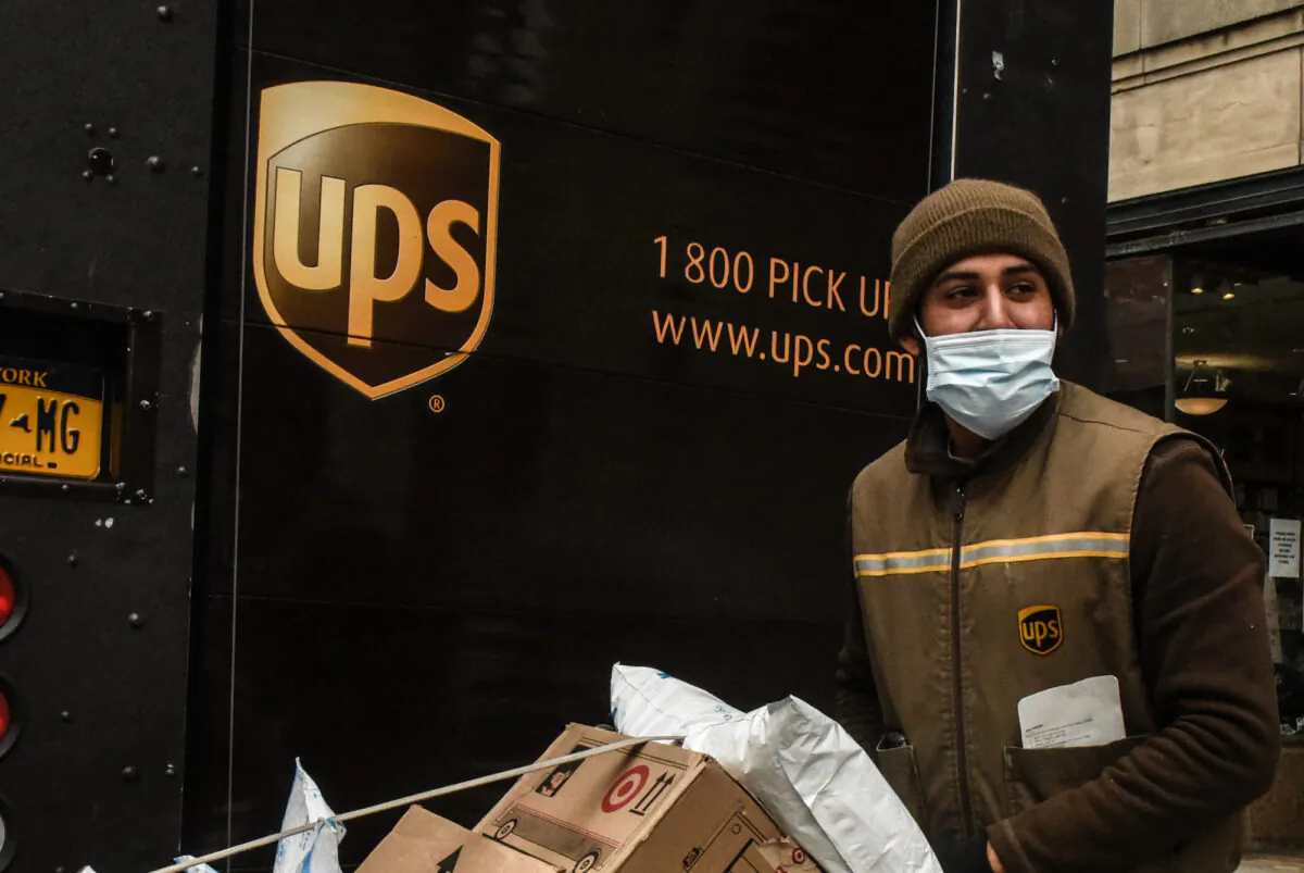 A UPS worker delivers packages in New York on April 29, 2020. (Stephanie Keith/Getty Images)