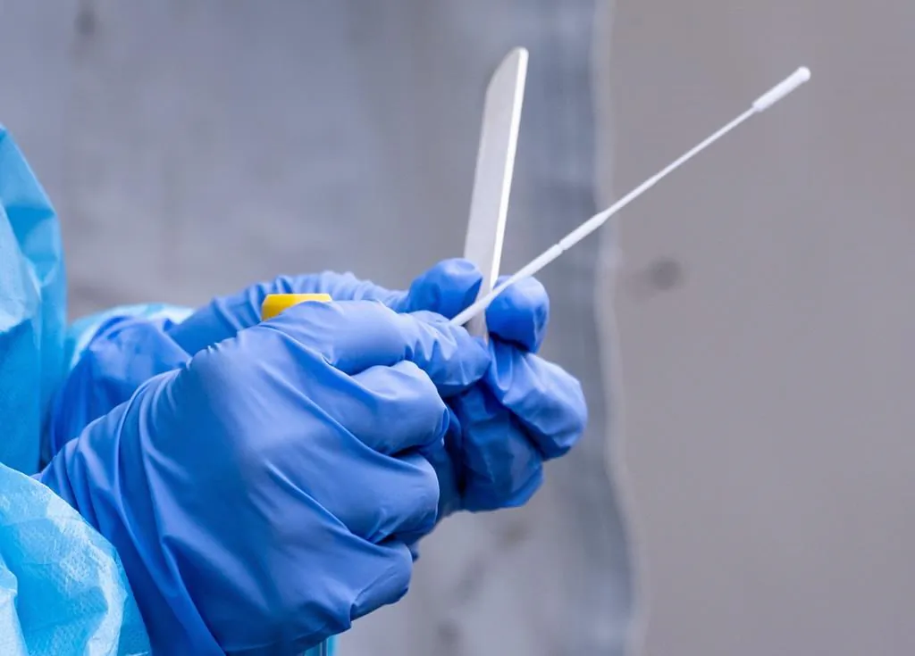 A health worker holds a nasal swab test for COVID-19. Health Canada announced on Oct. 6, 2020, that they have given the green light to the first antigen test to be approved in Canada. (The Canadian Press)