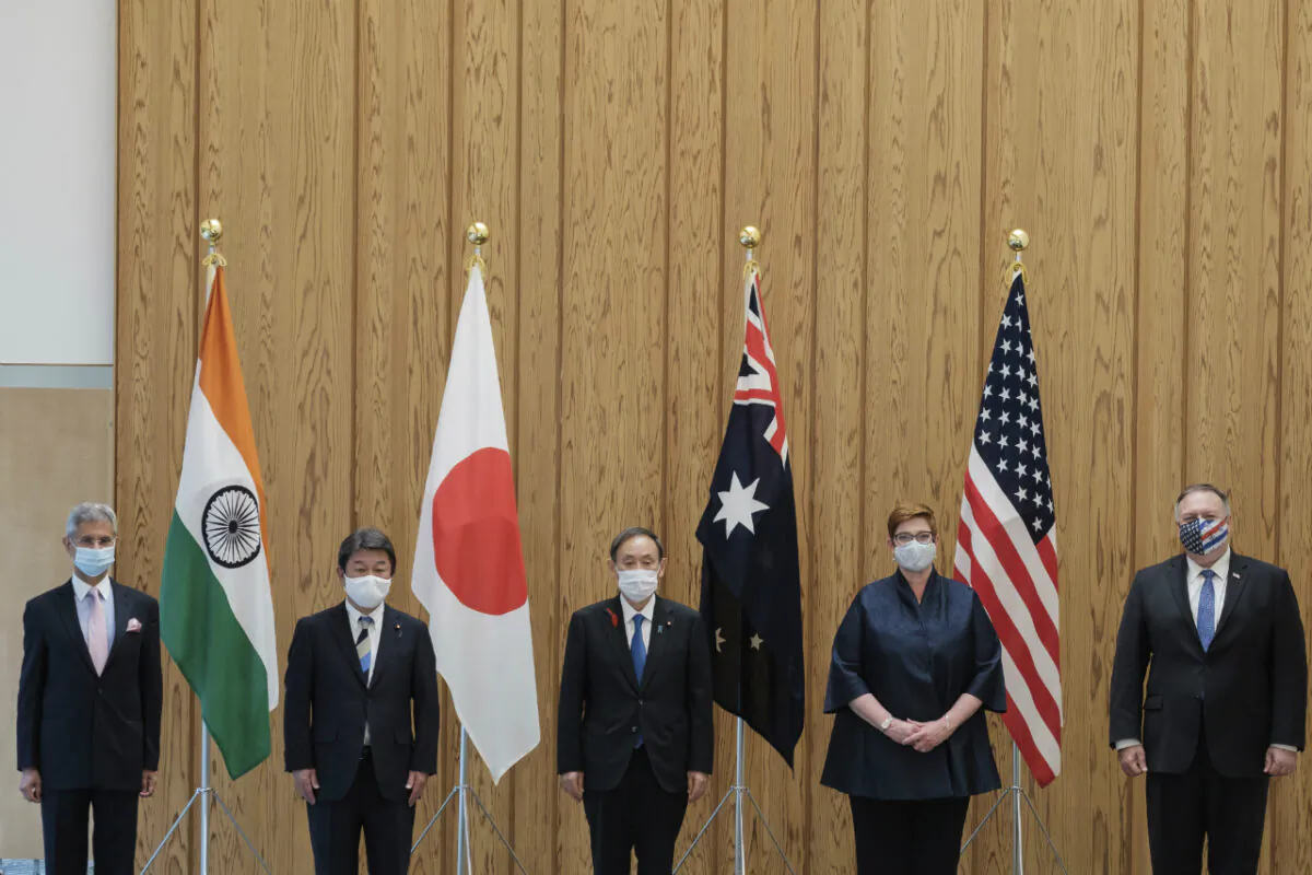 From left to right, Indian Minister of External Affairs Subrahmanyam Jaishankar, Japanese Foreign Minister Toshimitsu Motegi, Japanese Prime Minister Yoshihide Suga, Australian Foreign Minister Marise Payne and U.S. Secretary of State Mike Pompeo pose for a picture before a four Indo-Pacific nations' foreign ministers meeting at the prime minister's office in Tokyo Tuesday, Oct. 6, 2020. (Nicolas Datiche/Pool Photo via AP)