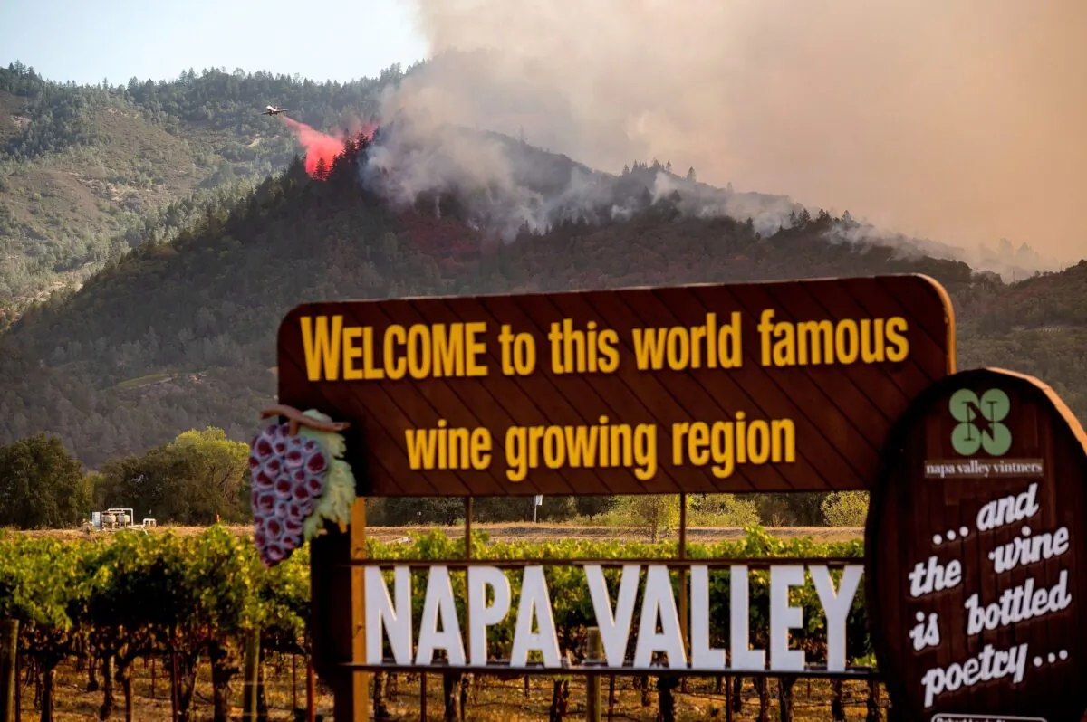 An air tanker drops retardant on the Glass Fire burning in Calistoga, Calif., on Sept. 27, 2020. (Noah Berger/AP Photo)