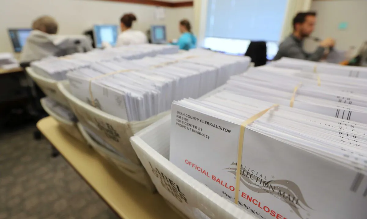 Thousands of ballots sit in boxes as Utah County election workers process the mail-in ballots for the midterm elections in Provo, Utah, on Nov. 6, 2018. (George Frey/Getty Images)