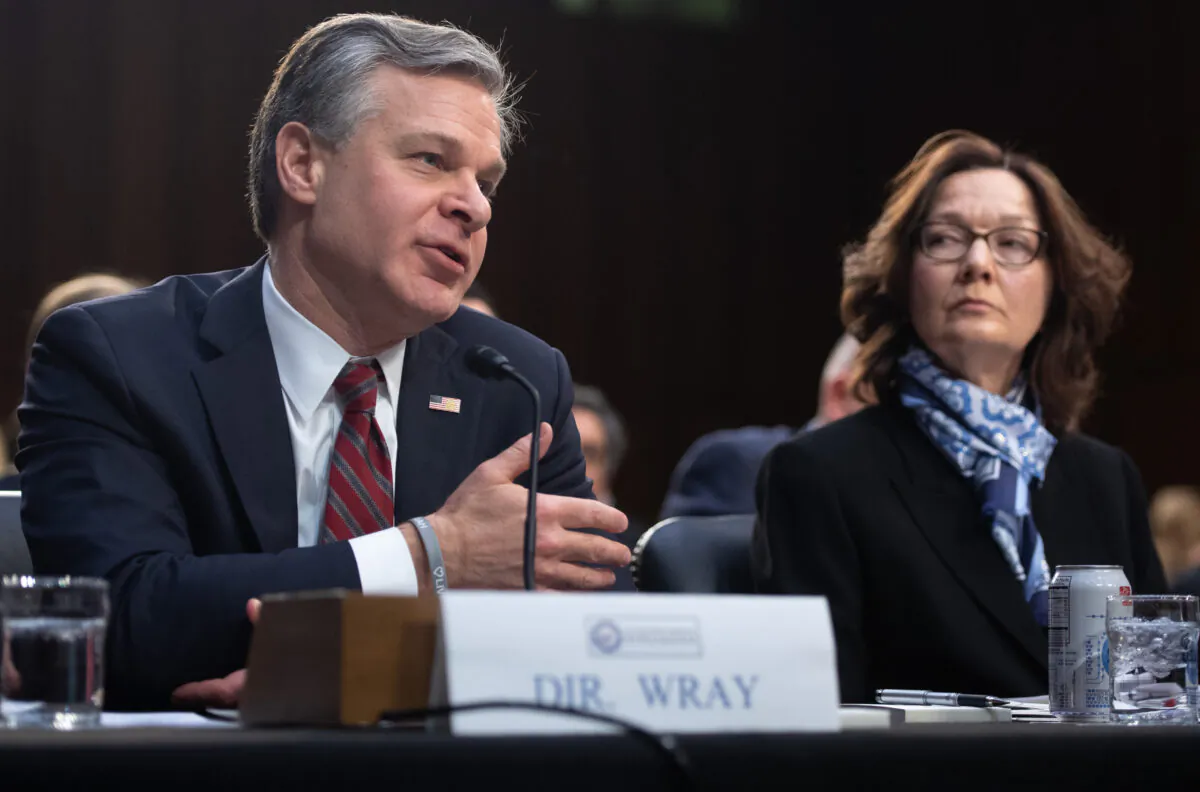 Christopher Wray (L), director of the Federal Bureau of Investigation (FBI) and Gina Haspel (R), director of the Central Intelligence Agency (CIA), testify on Worldwide Threats during a Senate Select Committee on Intelligence hearing on Capitol Hill in Washington on Jan. 29, 2019. (Saul Loeb/AFP via Getty Images)