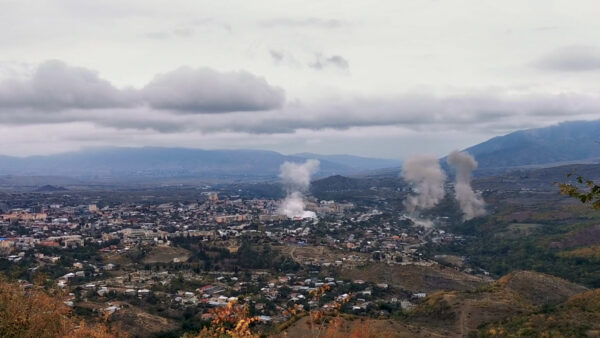 Smoke rises above the city