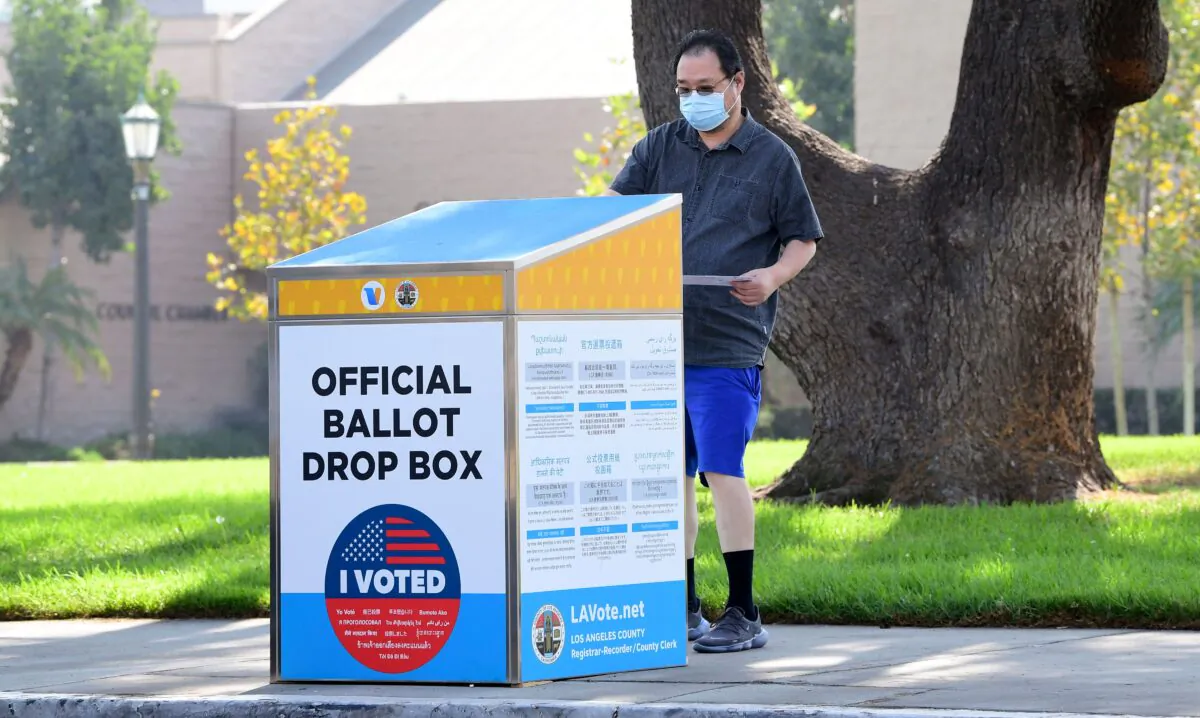 A ballot is dropped off at an official ballot drop box in Monterey Park, Calif., on Oct. 5, 2020. (Frederic J. Brown/AFP via Getty Images)