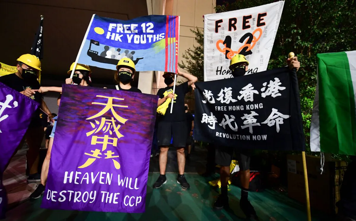 Protesters supporting Hong Kong gather across the road from the Chinese Consulate in Los Angeles on October 1, 2020 during a global day of action called by "Resist China" (#ResistChina), a global campaign against the regime of the Chinese Communist Party. (Photo by FREDERIC J. BROWN/AFP via Getty Images)