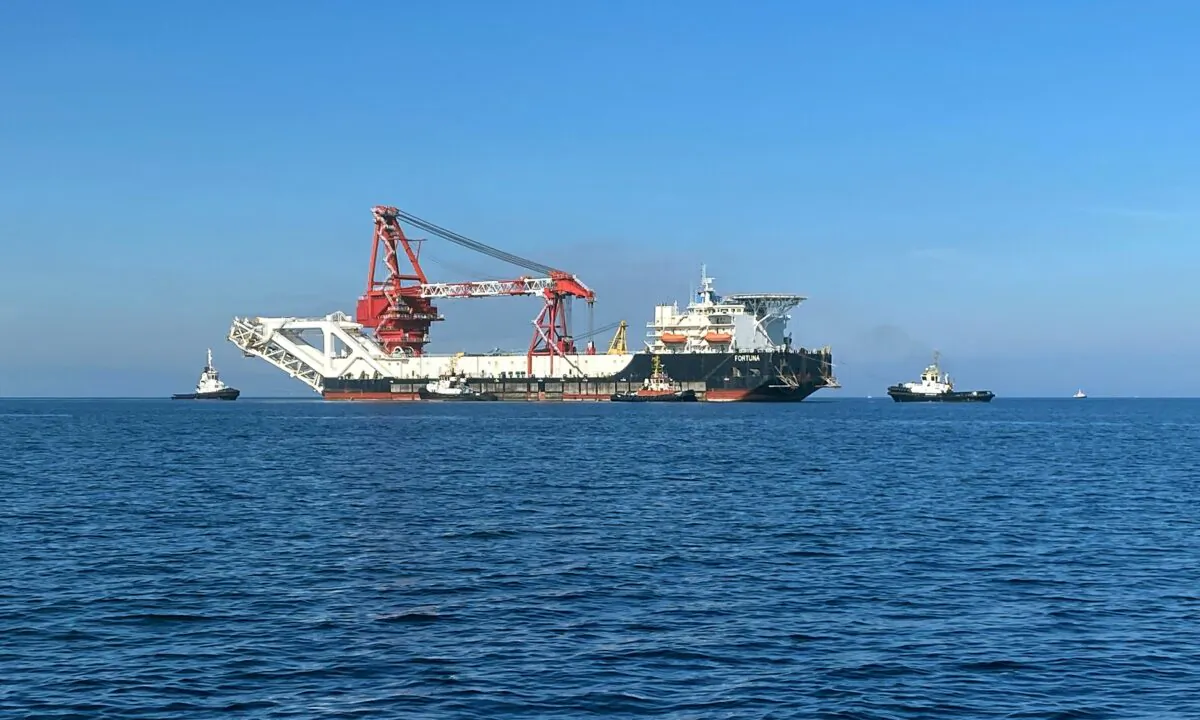 The pipe-laying vessel Fortuna, which may be used to complete the construction of the Nord Stream 2 Baltic Sea gas pipeline, makes its way to Wismar, Germany, on Sept. 30, 2020. (Oliver Denzer/Reuters)
