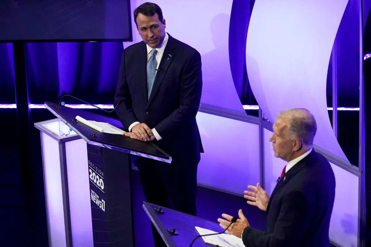 Sen. Thom Tillis (R-N.C.), right, speaks as Democratic challenger Cal Cunningham listens during a televised debate in Raleigh, N.C., Oct. 1, 2020. (Gerry Broome, Pool/AP Photo)