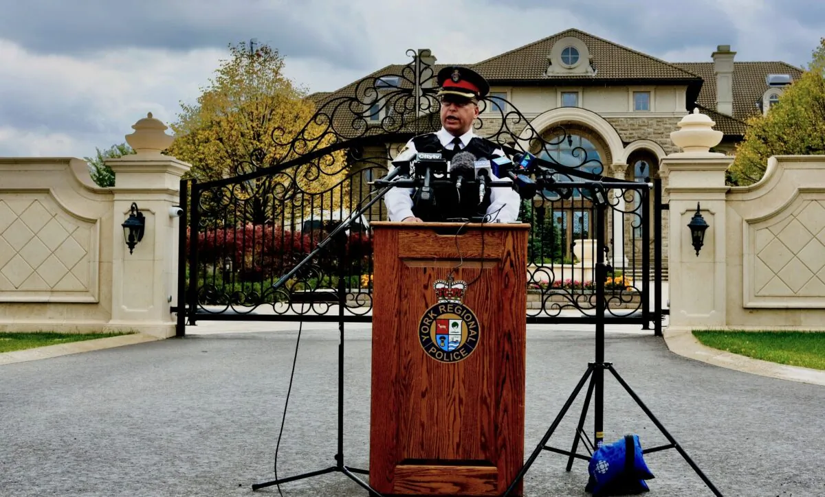 Superintendent Michael Slack with the York Regional Police holds a press conference in front of a mansion allegedly used to run an illegal gambling operation in Markham, Ont., on Sept. 30, 2020. (Becky Zhou/The Epoch Times)