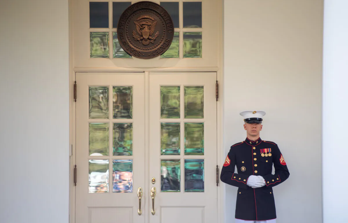 A US Marine stands guard outside the West Wing, indicating that President Donald Trump is in the Oval Office, at the White House in Washington, on Oct. 7, 2020. (Saul Loeb/AFP via Getty Images)