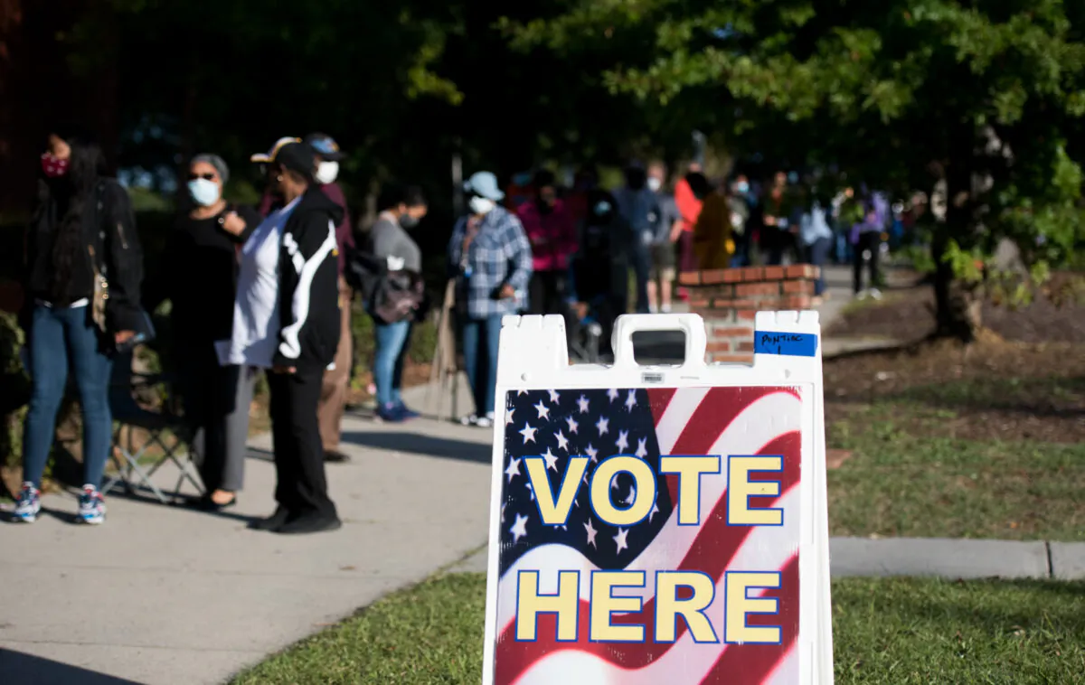 People stand in line outside the Richland County Voter Registration & Elections Office on the second day of in-person absentee and early voting in Columbia, S.C., on Oct. 6, 2020. (Sean Rayford/Getty Images)