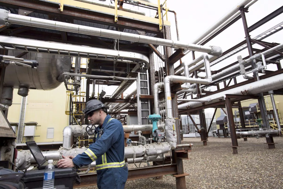 An instrumentation craftsman works at the Shell Saturn natural gas plant near Fort St. John, B.C., Oct. 11, 2018. (THE CANADIAN PRESS/Jonathan Hayward)