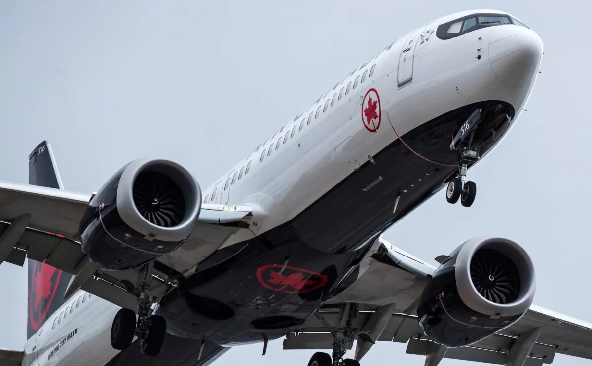 An Air Canada Boeing 737 Max 8 aircraft arriving from Toronto prepares to land at Vancouver International Airport, in Richmond, B.C., Canada on March 12, 2019. (Darryl Dyck/The Canadian Press)