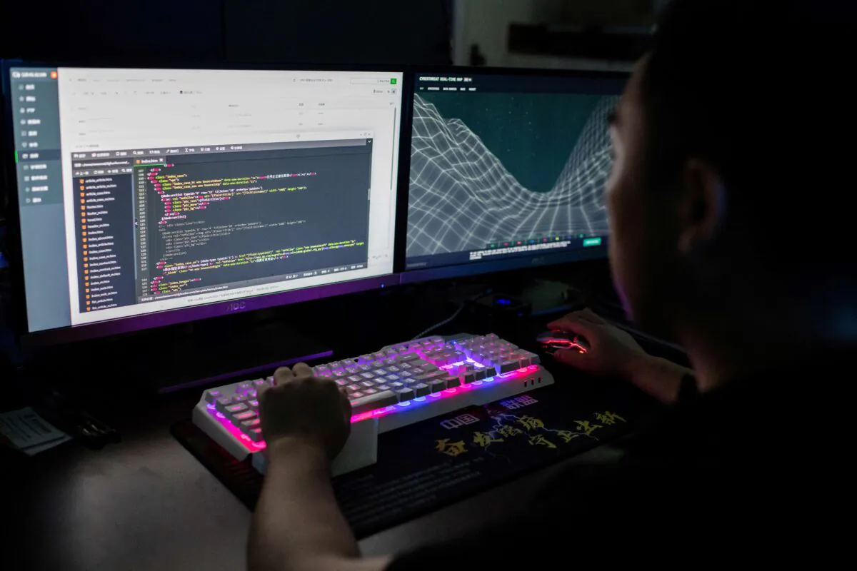A member of the hacking group Red Hacker Alliance is using a website that monitors global cyberattacks on his computer at an office in Dongguan, China's southern Guangdong Province on Aug. 4, 2020. (Nicolas Asfouri/AFP via Getty Images)