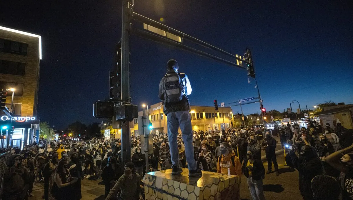 Demonstrators block an intersection in Minneapolis on Oct. 7, 2020, after Derek Chauvin, the former Minneapolis police officer charged with murder in the death of George Floyd, posted bail and was released from prison. (Carlos Gonzalez/Star Tribune via AP)