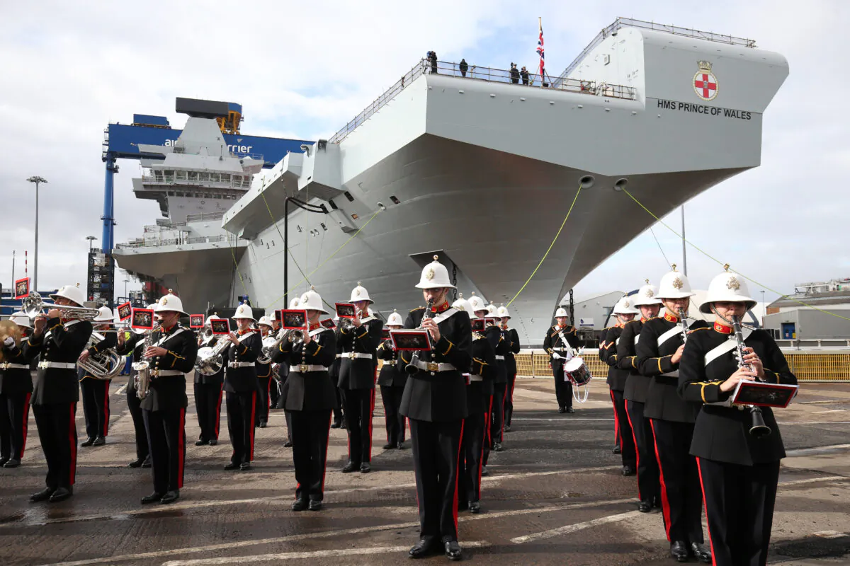 The Royal Marine band play ahead of a naming ceremony of aircraft carrier HMS Prince of Wales at the Royal Dockyard in Rosyth, Scotland, on Sept. 8, 2017. (Jane Barlow/WPA Pool/Getty Images)