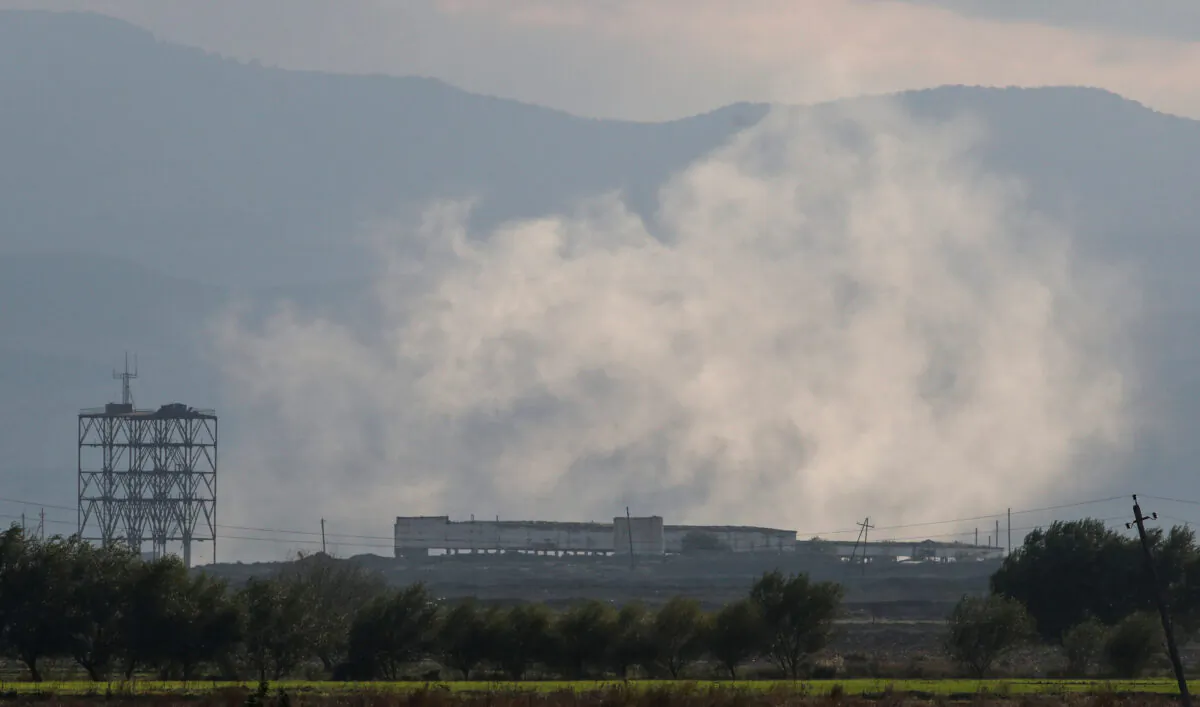 Smoke rises as Azerbaijan forces shell targets during the fighting over the breakaway region of Nagorno-Karabakh near the city of Terter, Azerbaijan, on Oct. 9, 2020. (Umit Bektas/ Reuters)