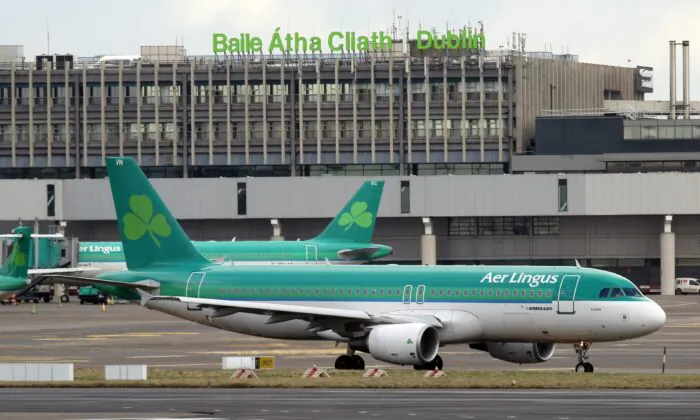 Aer Lingus passenger jets taxi at Dublin Airport in Ireland, on Jan. 27, 2015. (Paul Faith/AFP via Getty Images)

