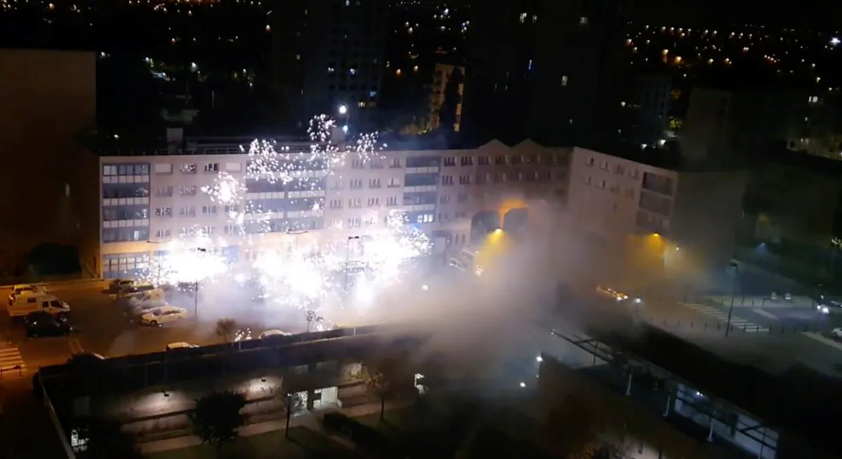 People use fireworks as projectiles as they stage an attack on a police station in Champigny, metropolitan Paris, France, on Oct. 11, 2020. (Instagram @funnyfamilyzen via Reuters)