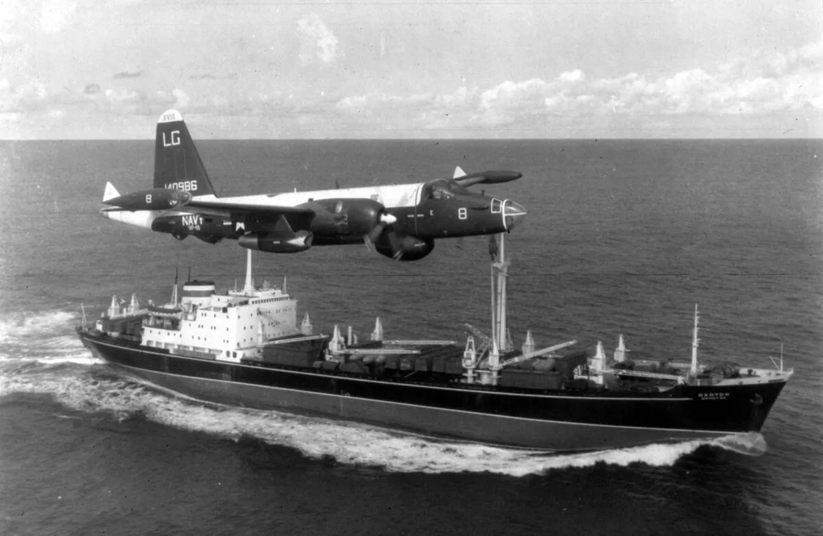 A P2V Neptune U.S. patrol plane flies over a Soviet freighter during the Cuban Missile Crisis in October 1962. The crisis brought the world to the verge of nuclear catastrophe. (MPI/Getty Images)