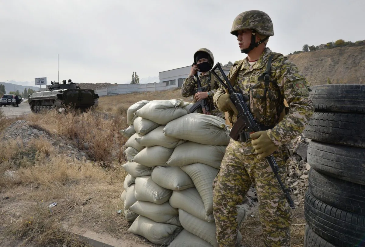 Soldiers of Kyrgyz army stand at checkpoint on city street in Bishkek, Kyrgyzstan, on Oct. 10, 2020. (Vladimir Voronin/AP Photo)