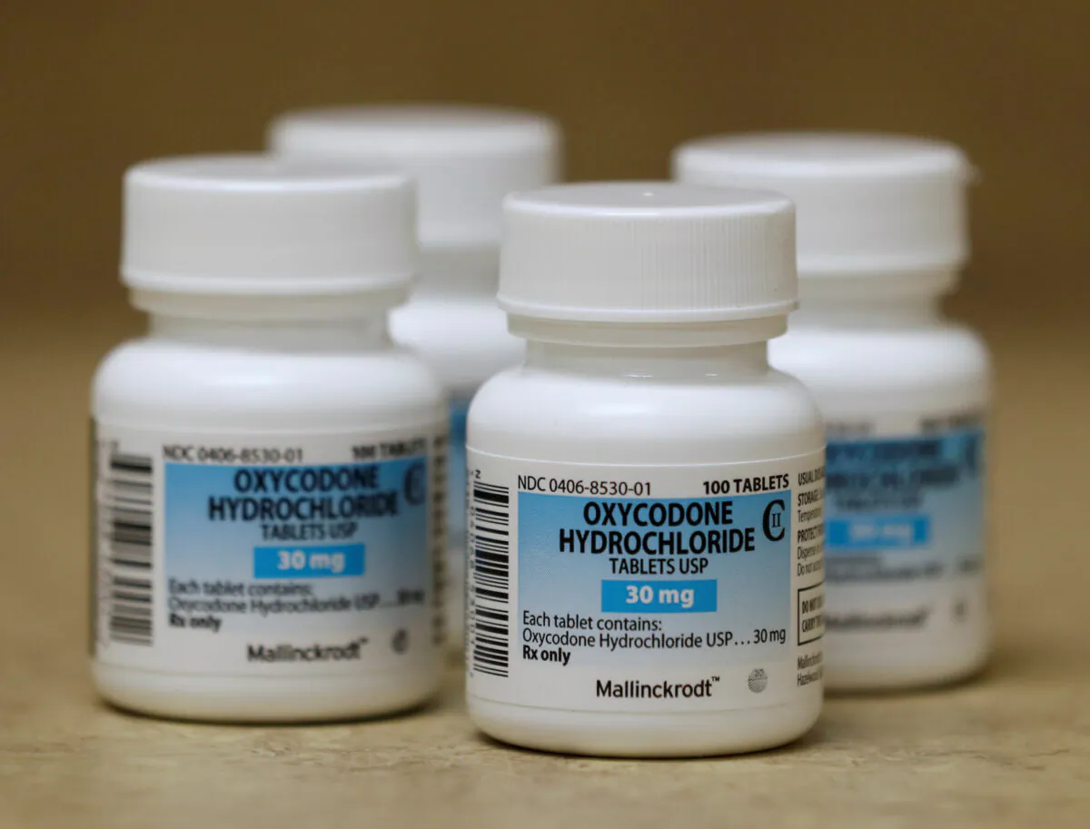 Bottles of prescription painkillers Oxycodone Hydrochloride, 30mg pills, made by Mallinckrodt sit on a counter at a local pharmacy, in Provo, Utah, on April 25, 2017. (George Frey/Reuters)