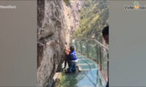 Man Scared To Death Walking Across Glass Walkway